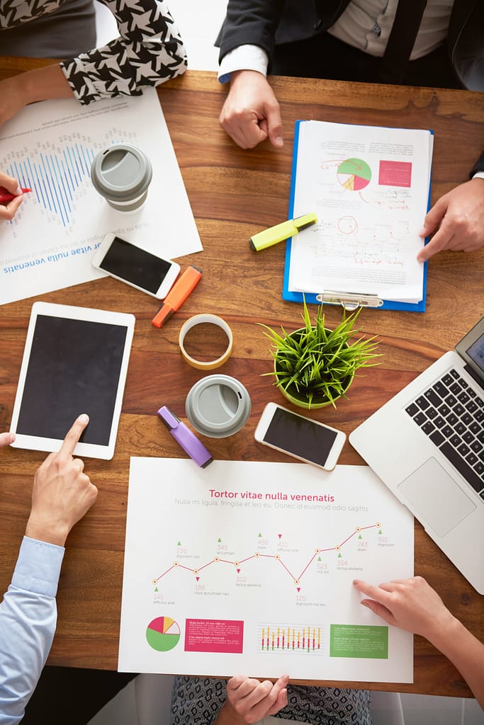 Bird’s eye view of business people working over some documents